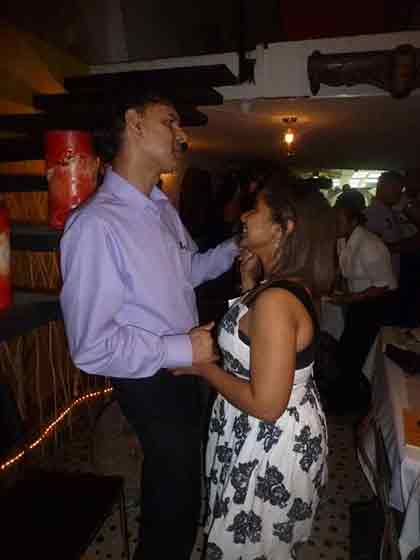 A photo of a man and a woman dancing.